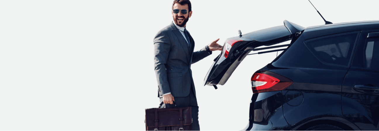Self-drive rental customer standing near a vehicle